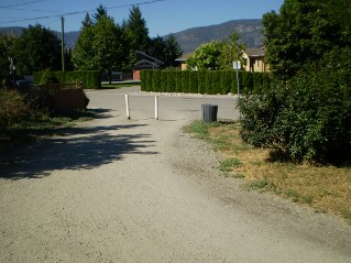 Looking back at entrance to trail head off Vancouver PL in Penticton, Kettle Valley Railway Penticton to Naramata, 2011-08.